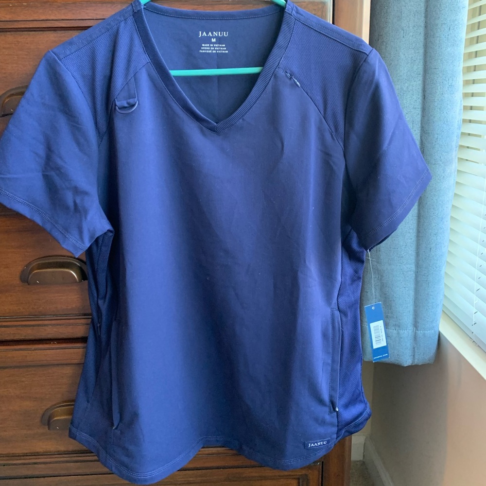 Navy blue Jaanuu women’s scrub top